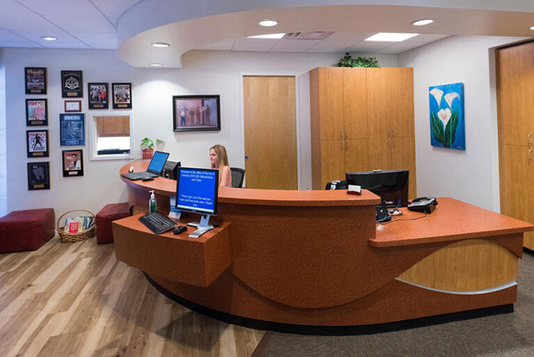 Reception area with front desk at SS Orthodontics in Glendale and Phoenix, AZ