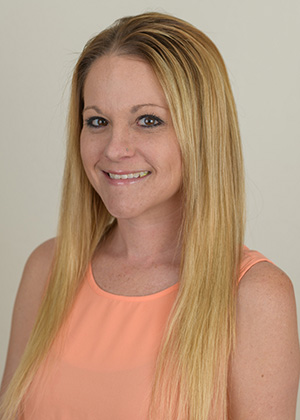 Staff photo of Jessica with long straight blonde hair in a peach blouse smiling at SS Orthodontics in Glendale and Phoenix, AZ